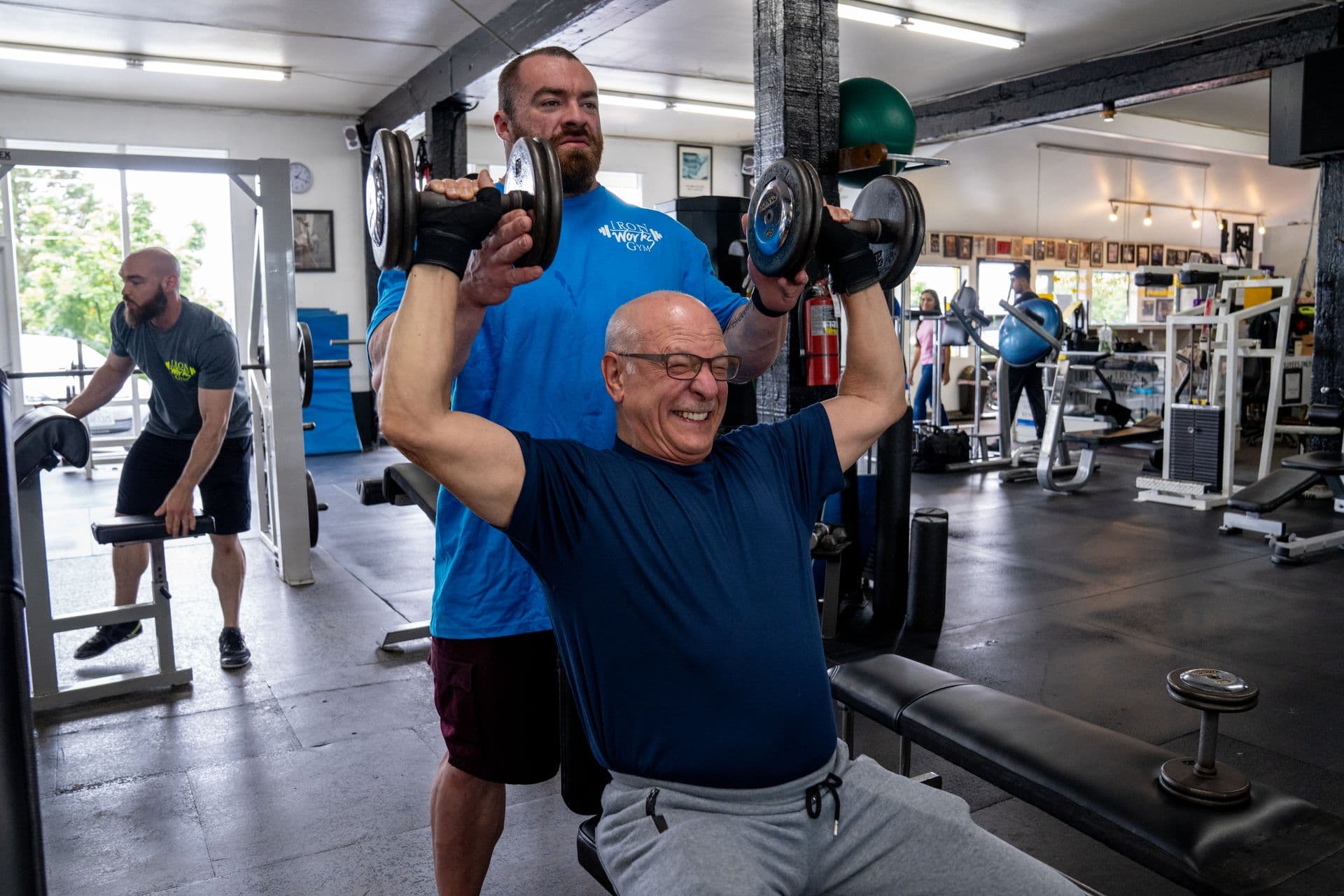 Personal trainer coaching client at Iron Works Gym